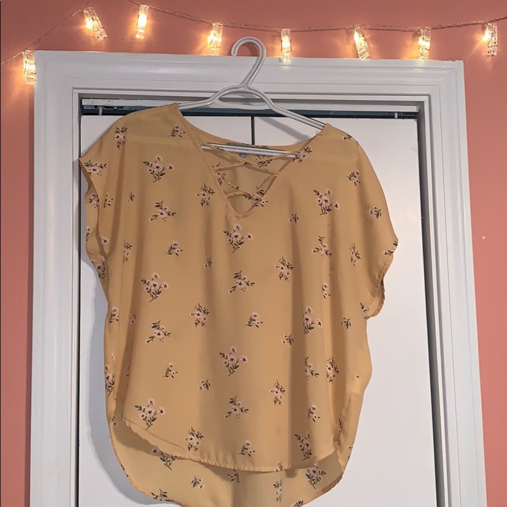 A yellow floral blouse.